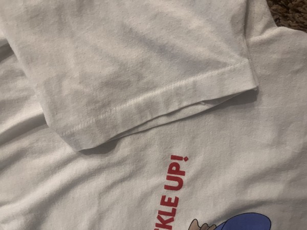 Price check for this vintage 80’s Donald Duck seat belt shirt