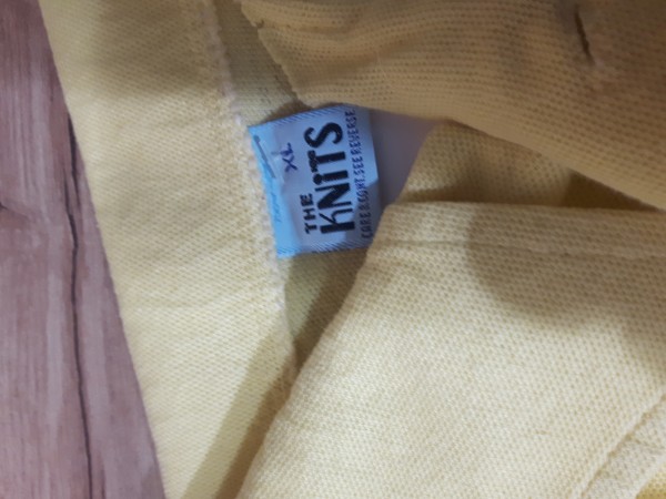 the knits tag on polo collar shirt