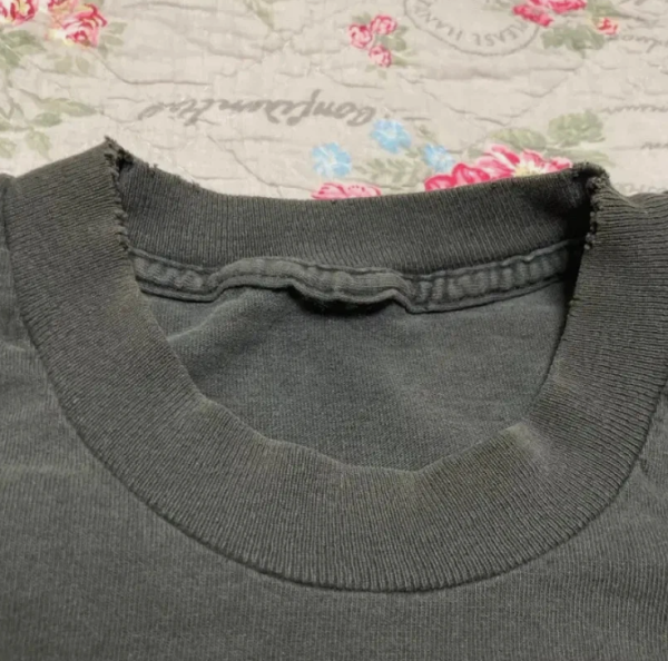 cut tag; looks like it was a black tag(?)