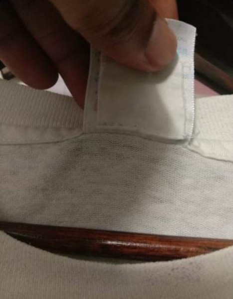 tag sewn in under hanes tag