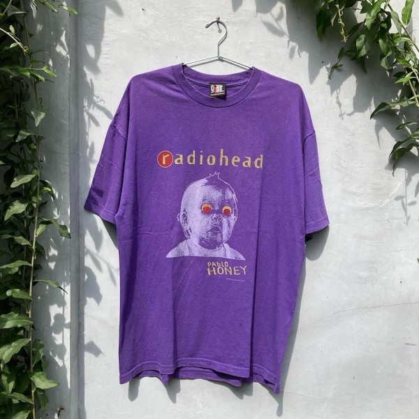 Check tag giant on radiohead tees