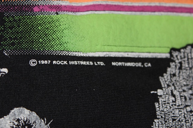 also says burton 84 at the bottom. (rock & roll tee)