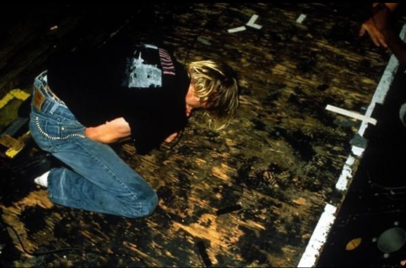 Kurt wearing Nirvana t-shirt on stage