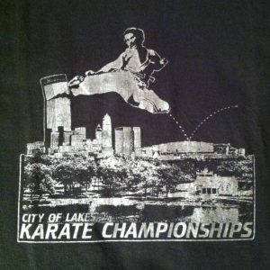 Vintage Guy kicking over a building in Minneapols t-shirt