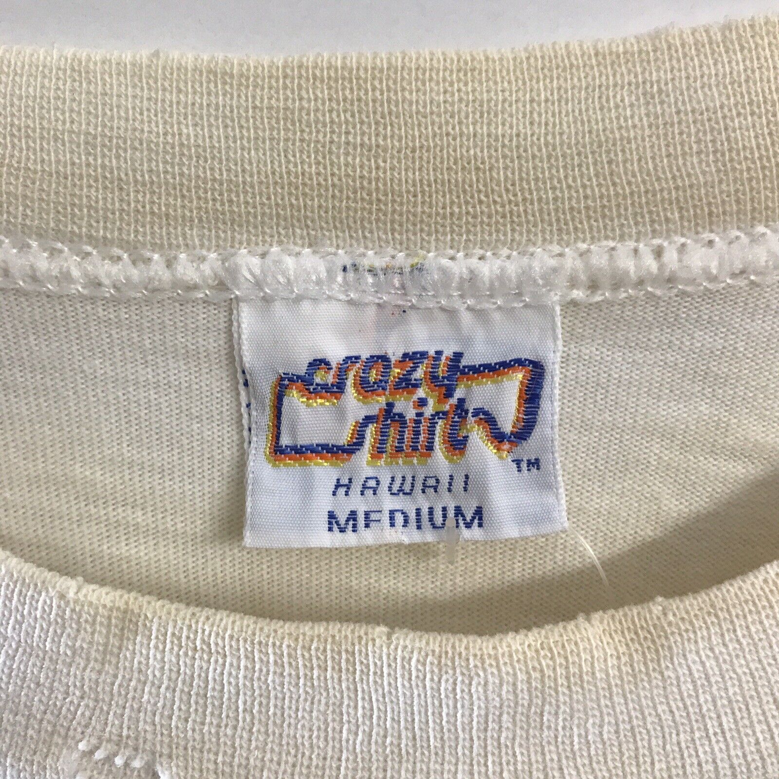 crazy shirts tag 1984 and 1985 new design with no fill in the border with TM