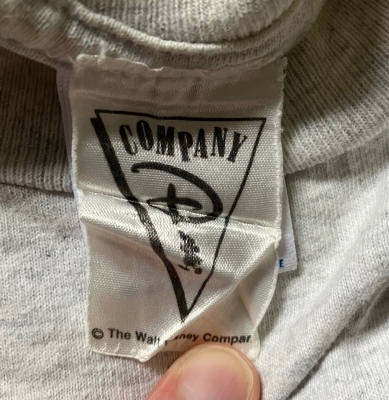 the walt disney company t-shirt tag triangle