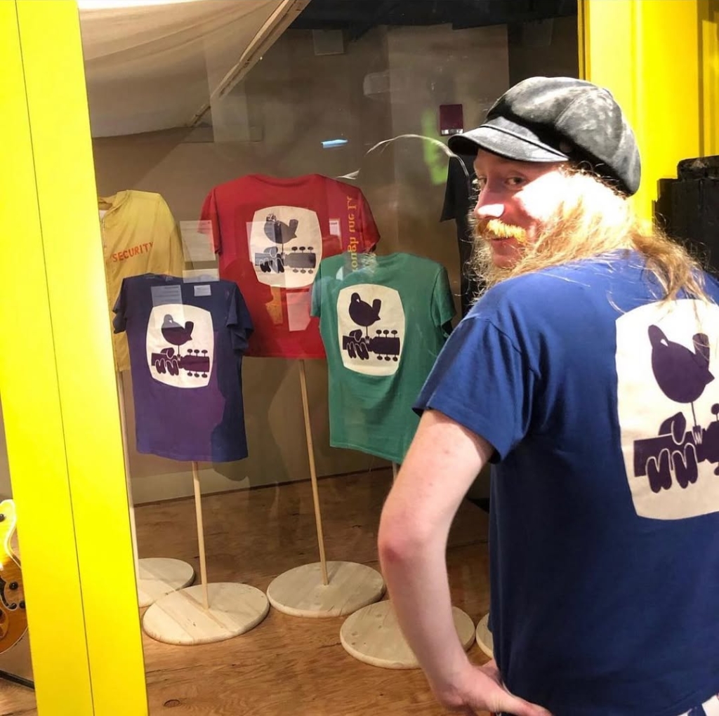 True vintage Woodstock t-shirts on Display, Blue, Green, Red. 