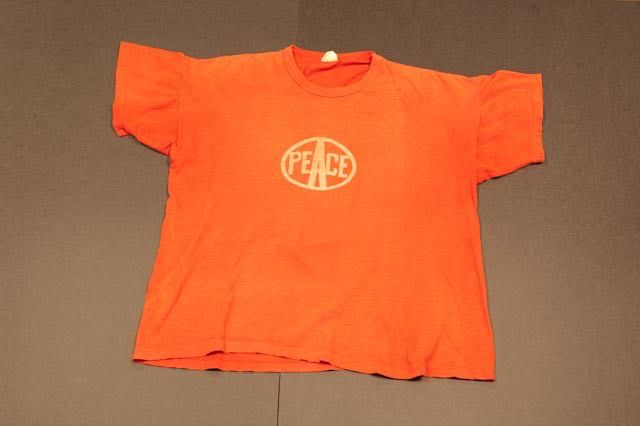 Faded red woodstock staff security t-shirt